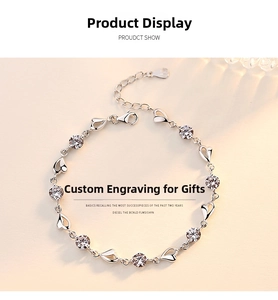 Macro detail of 925 sterling silver heart bracelet with cubic zirconia and lobster clasp