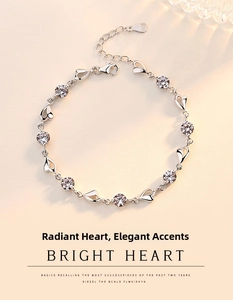 Detailed view of a 925 sterling silver heart bracelet with cubic zirconia and heart charm