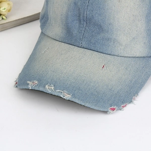Vintage light blue washed denim baseball cap with distressed brim and retro finish