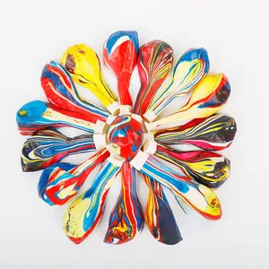 Flat lay of sixteen colorful marble agate latex balloons arranged in a radial pattern