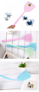 Detail of durable long handle plastic fly swatters in pink, blue and green colors