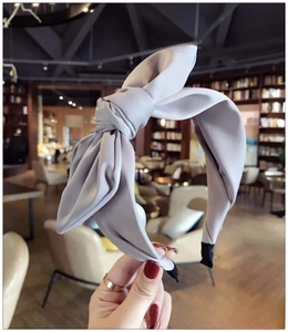 Detailed view of lavender purple fabric headband with a stylish large 3D bow texture