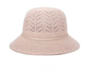 Detail of breathable knit pattern on pink sun hat for women with textured V-shape weave