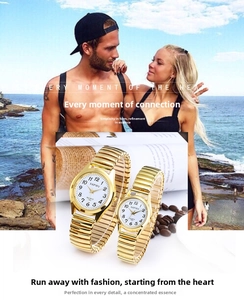 Detail of couple watches with gold stretch bands and white quartz dials for seniors
