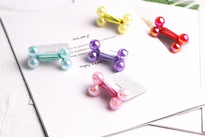 Detail of colorful hair ties with iridescent glitter beads in five vibrant colors