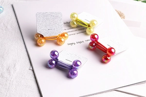 Detail of high-elasticity hair ties featuring glittery Aurora beads in four vibrant colors