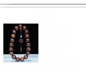 Detail of Rosewood Buddhist beads with traditional Chinese knot and silk tassels for car décor