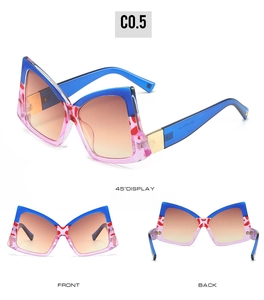 Detailed views of bow-shaped oversized sunglasses in blue-pink frames with spotted patterns