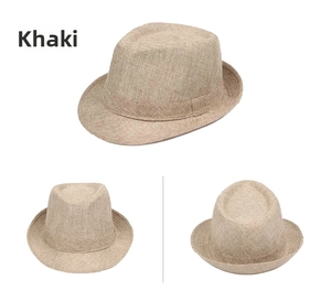 Detailed weave texture of the khaki straw sun hat featuring a classic fedora crown and band