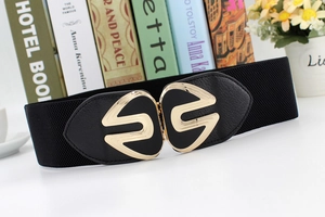 Detail of a wide black elastic waist belt for women with a gold geometric metal buckle
