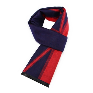 Detail of dark blue and red striped winter scarf with short fringe on white background
