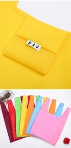 Macro detail of foldable oxford shopping bags in multiple bright colors and textures