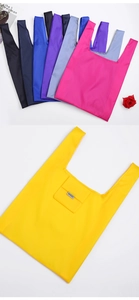Detailed view of colorful foldable nylon tote bags available in multiple vibrant colors