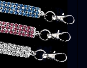 Detail of 3-row rhinestone pet collars in blue, pink, and silver with lobster clasps