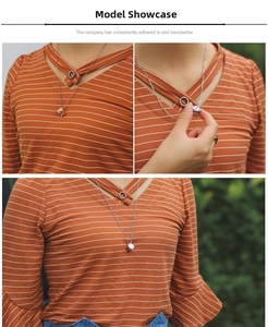 Detailed view of silver and gold dice pendants on delicate metal chains in outdoor setting