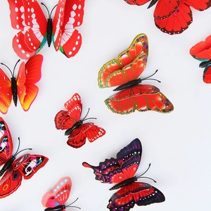 Close-up of 3D double-layer butterfly wall stickers in vibrant red and mixed colors