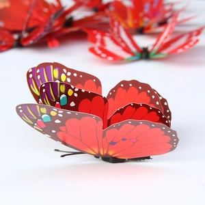 Macro view of 3D double-layer red PVC butterfly wall sticker with detailed wing patterns