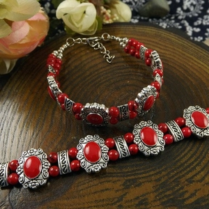 Ethnic bohemian red bead bracelet set with vintage engraved silver tone metal charms