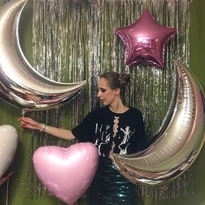 Silver moon and pink star foil balloons set displayed for birthday party decoration