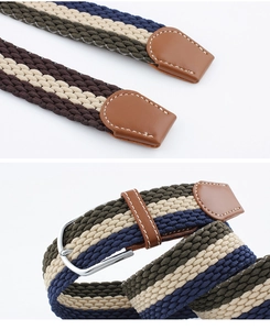 Detail of woven elastic belt showing silver metal buckle and striped fabric texture