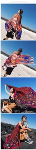 Bohemian paisley cotton shawl featuring vibrant orange prints and delicate tassel edges