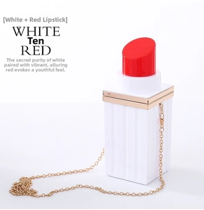 Detail of white and red lipstick shaped acrylic clutch bag with gold metal chain
