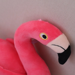 Pink flamingo plush toy with detailed embroidery and soft polyester texture for girls