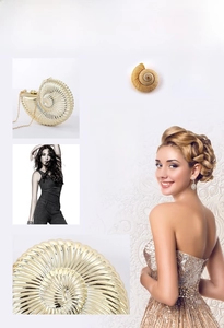 Detailed view of a gold conch-shaped evening clutch bag with spiral texture and chain