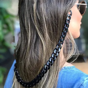 Detail of chunky black acrylic glasses chain showing bold links and metal connectors