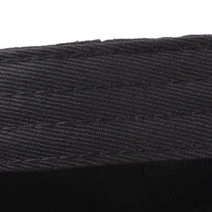 Close-up of black cotton twill baseball cap with detailed stitching and durable fabric