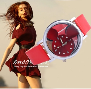 Detail of red cartoon watch with silver case and sparkling rhinestone hour markers