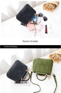 Details zur sechseckig gesteppten Handtasche mit goldenen Ringgriffen und Trageriemen
