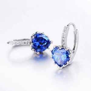 Macro view of blue heart-shaped cubic zirconia earrings with lever-back silver finish