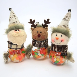 Three-piece Christmas candy jar set with Santa, Reindeer and Snowman plush lids and clear bases