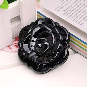 Glossy black rose-shaped vanity mirror for women with a multi-layered 3D flower design