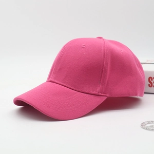 Detail view of the rose red cotton baseball cap with high quality stitching and texture