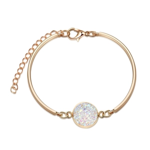 Close-up of rose gold bangle with white druzy stone and adjustable lobster clasp chain