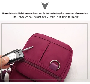 Close-up of durable purple nylon crossbody bag showing anti-scratch fabric with car keys