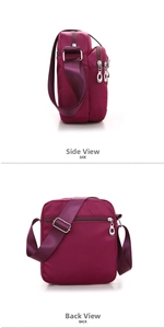 Detail view of purple nylon crossbody bag showing side and back zippered compartments
