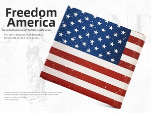 Detail of short bifold wallet featuring vintage American flag print and faux leather texture