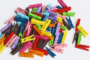 Close-up of colorful mini wooden clothespins for photo hanging and DIY crafts decoration