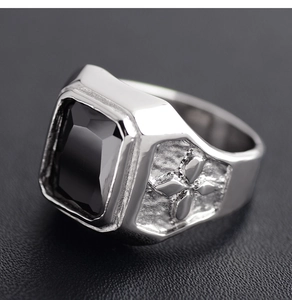 Detail view of rectangular black onyx gemstone and hammered silver stainless steel ring