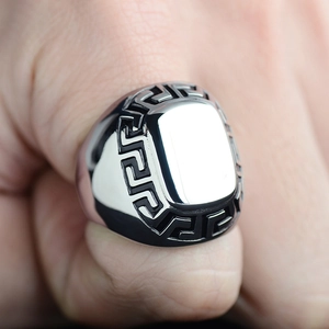 Polished titanium steel ring for men featuring classic Greek key pattern on hand