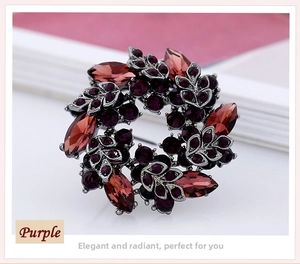 Macro detail of a vintage purple rhinestone wreath brooch with black nickel metal finish