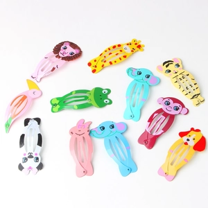 Close-up of colorful cartoon animal hair clips for kids on a white background