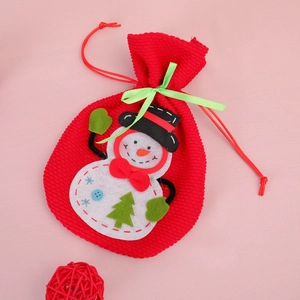 3D snowman Christmas drawstring gift bag with green ribbon on pink background