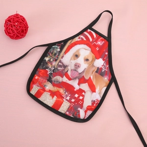 Detail of mini Christmas apron for wine bottles with dog print and red festive ribbons