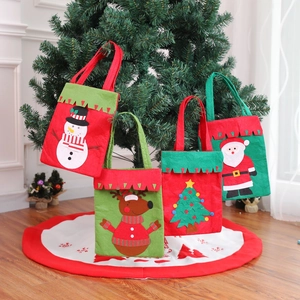 Set of 4 Christmas felt gift bags with Santa, reindeer, snowman and tree patterns