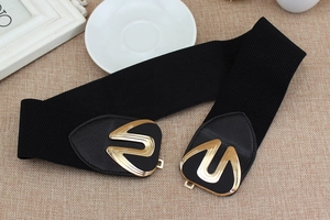 Close-up of black elastic wide belt for women with irregular gold metal buckle detail