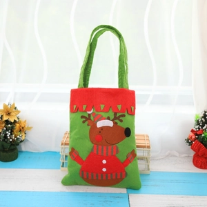 Thick handmade green Christmas felt gift bag with red trim and a reindeer pattern